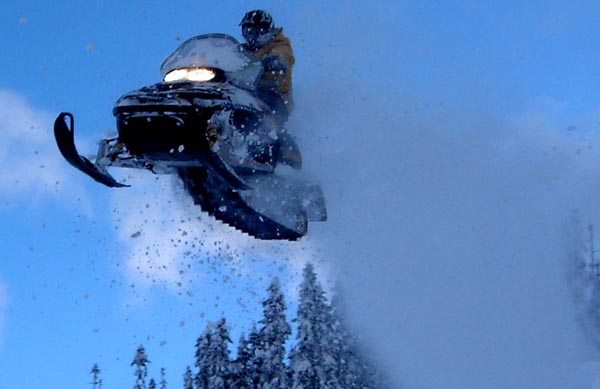 Benny Traub jumping a snowmobile